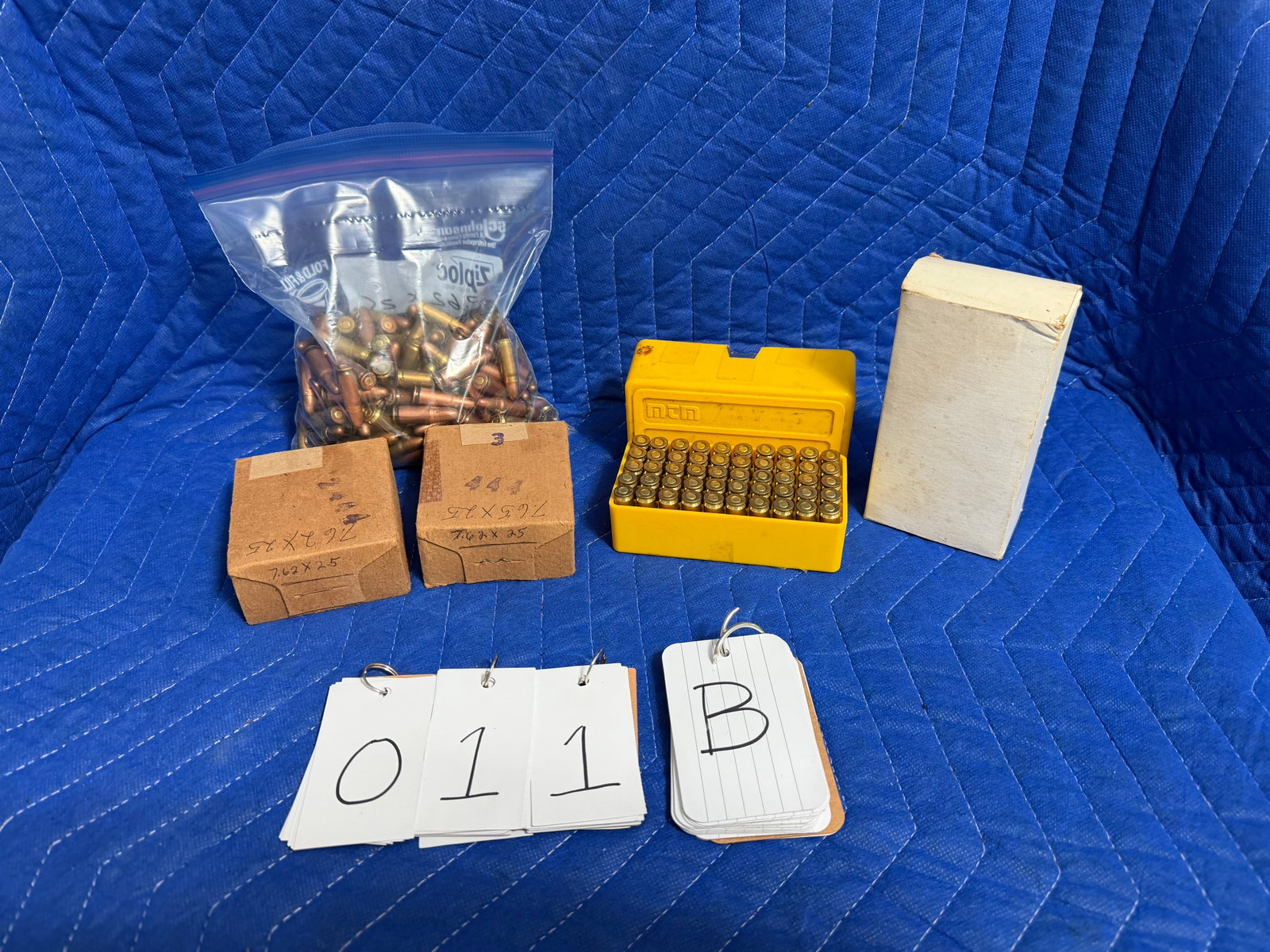 7.62x25mm Tokarev Ammo: 7.62x25mm Tokarev ammunition. One unmarked white box (50 rounds). One yellow polymer case (50 rounds of reloads). Two unopened unmarked boxes (100 rounds). One loose bag with 157 rounds. 357 rounds to