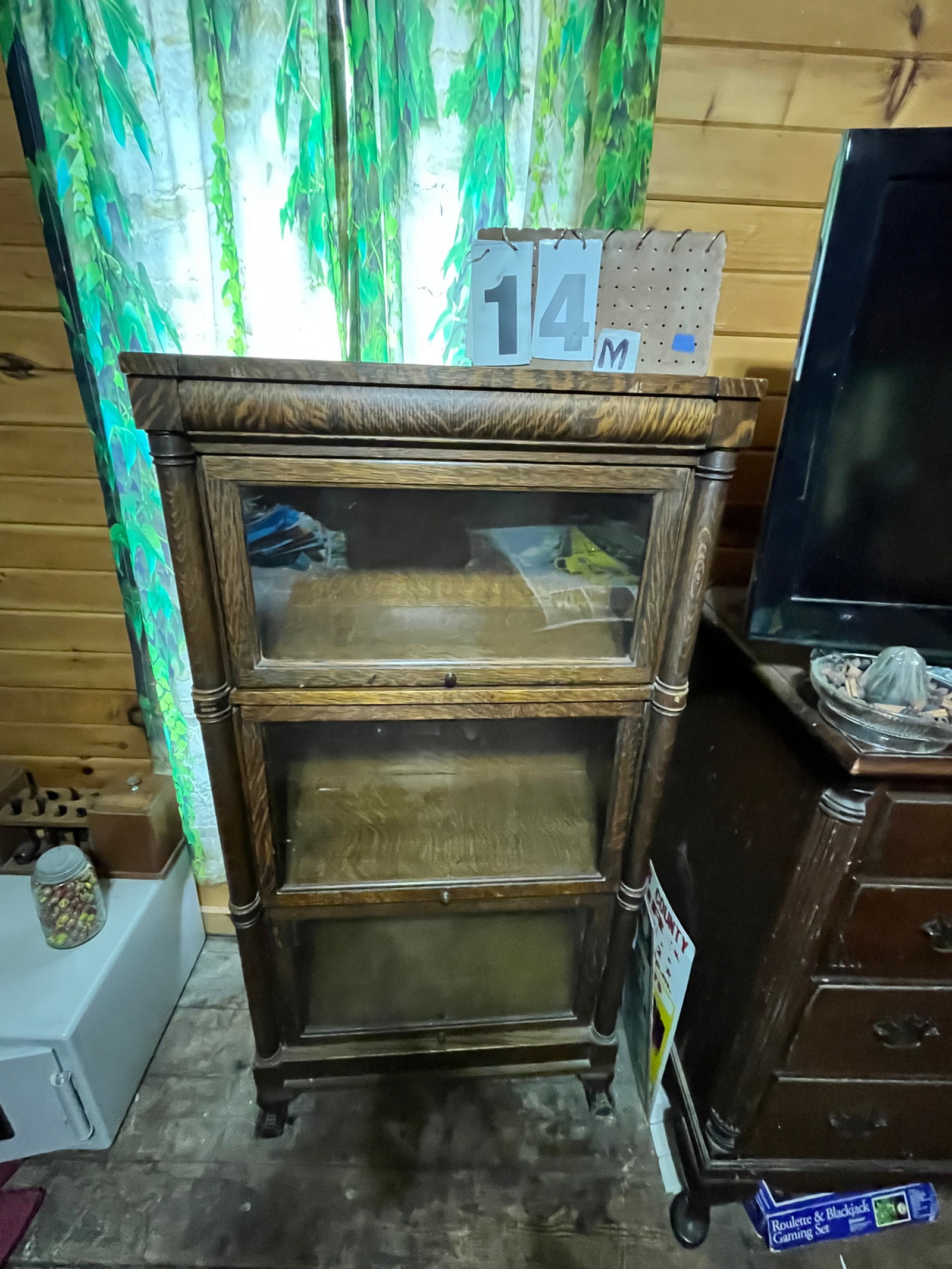 Narrow Clawfoot Three Piece Bookcase: Narrow clawfoot three piece bookcase. Quartersawn oak. 26.5"w x 13.5"d x 53.25"h. See photos. Please read the Terms and Conditions of this auction THOROUGHLY for IMPORTANT bidder information.