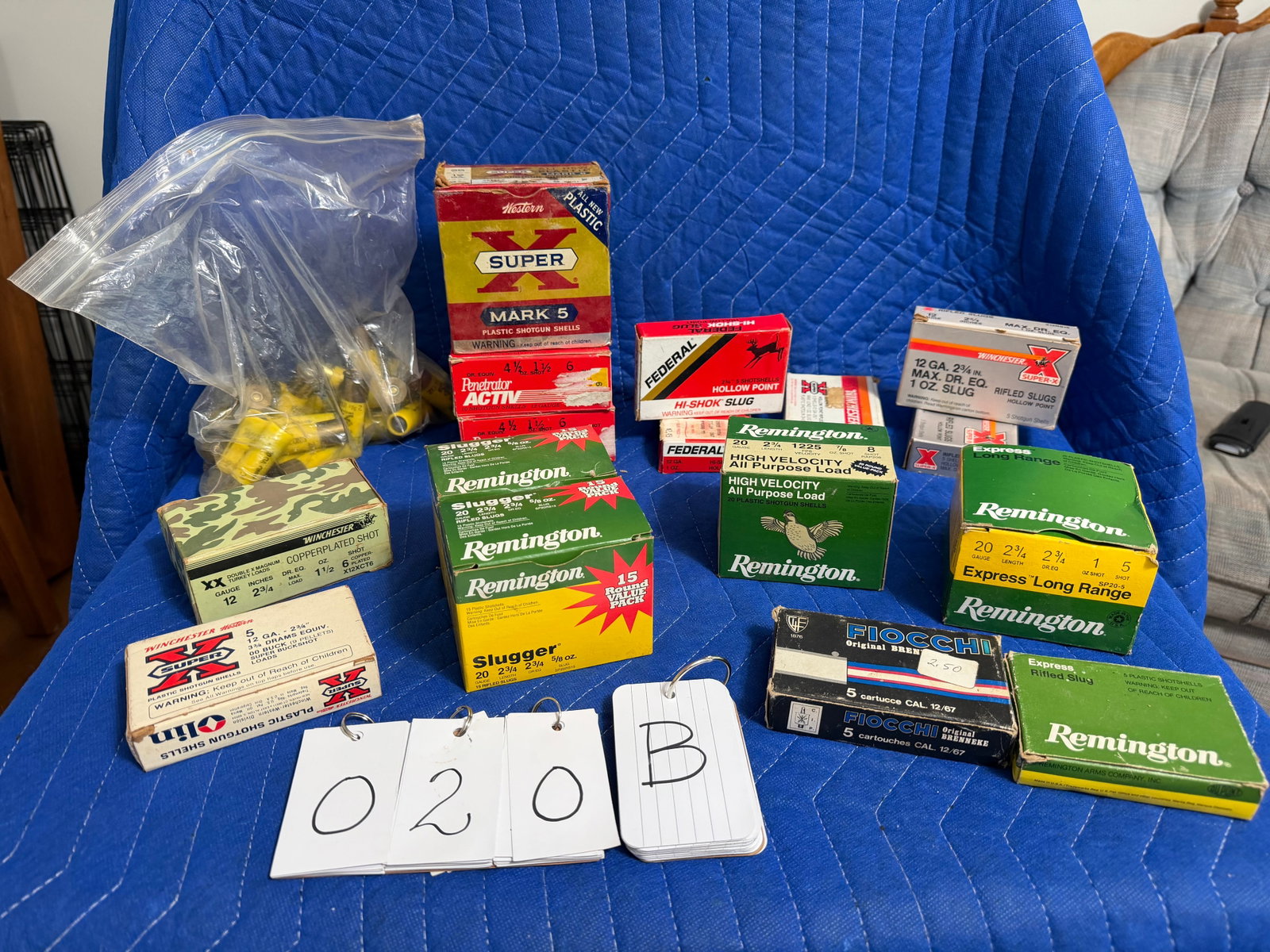 12 Gauge and 20 Gauge Ammo: 12 gauge and 20 gauge ammunition. Three boxes of Remington 20 gauge rifled slugs, 2.75" shells, 0.625 oz. (33 rounds). One loose bag of Winchester Super X 20 gauge slugs, 2.75" shells, 0.75 oz. (24