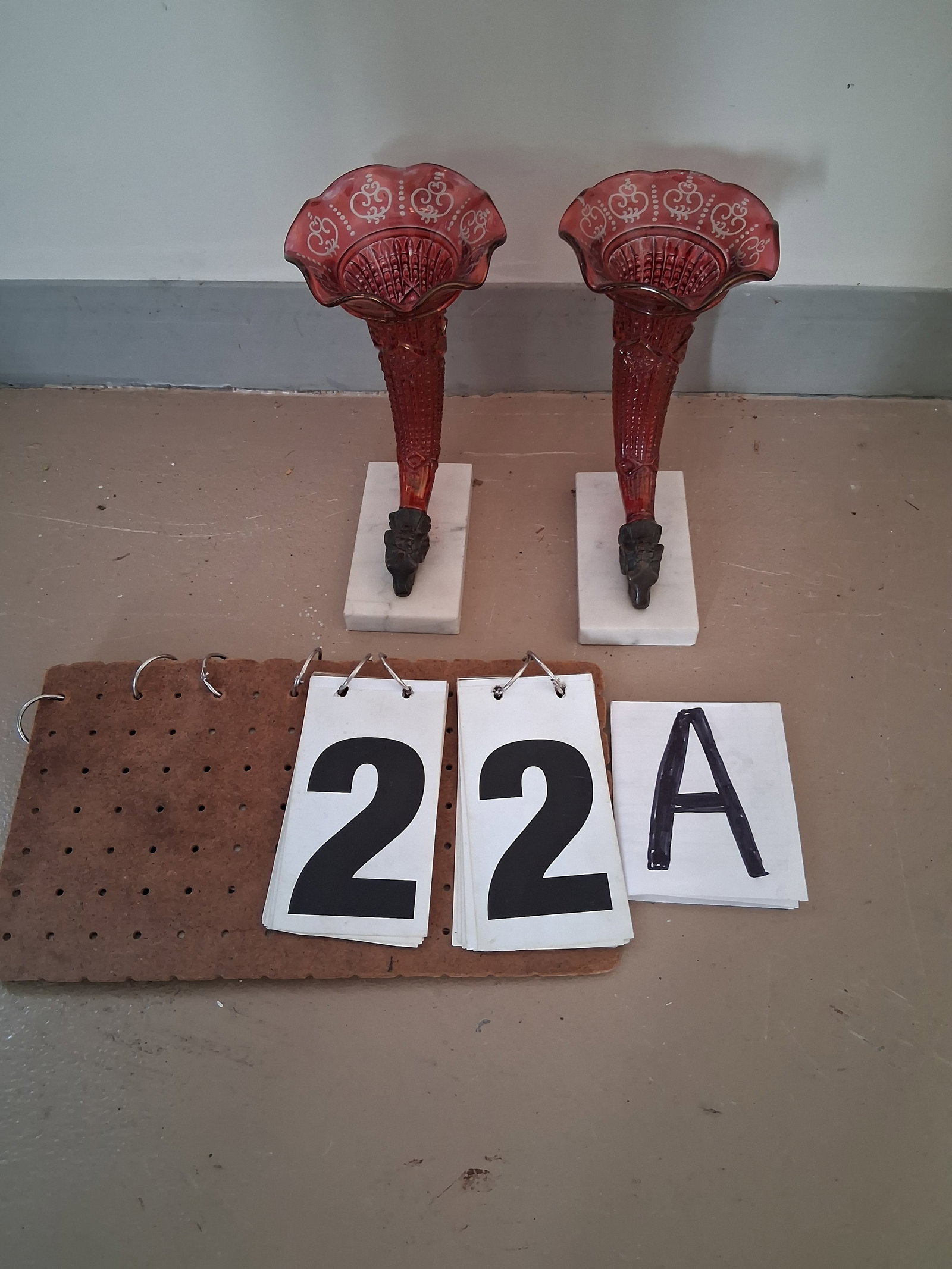 Pair of Marble Base Cranberry Cut to Clear Horns of Plenty Vases: Pair of marble base cranberry cut to clear horns of plenty vases. 5"w x 8"d x 8.5"h. See photos. Please read the Terms and Conditions of this auction THOROUGHLY for IMPORTANT bidder information.