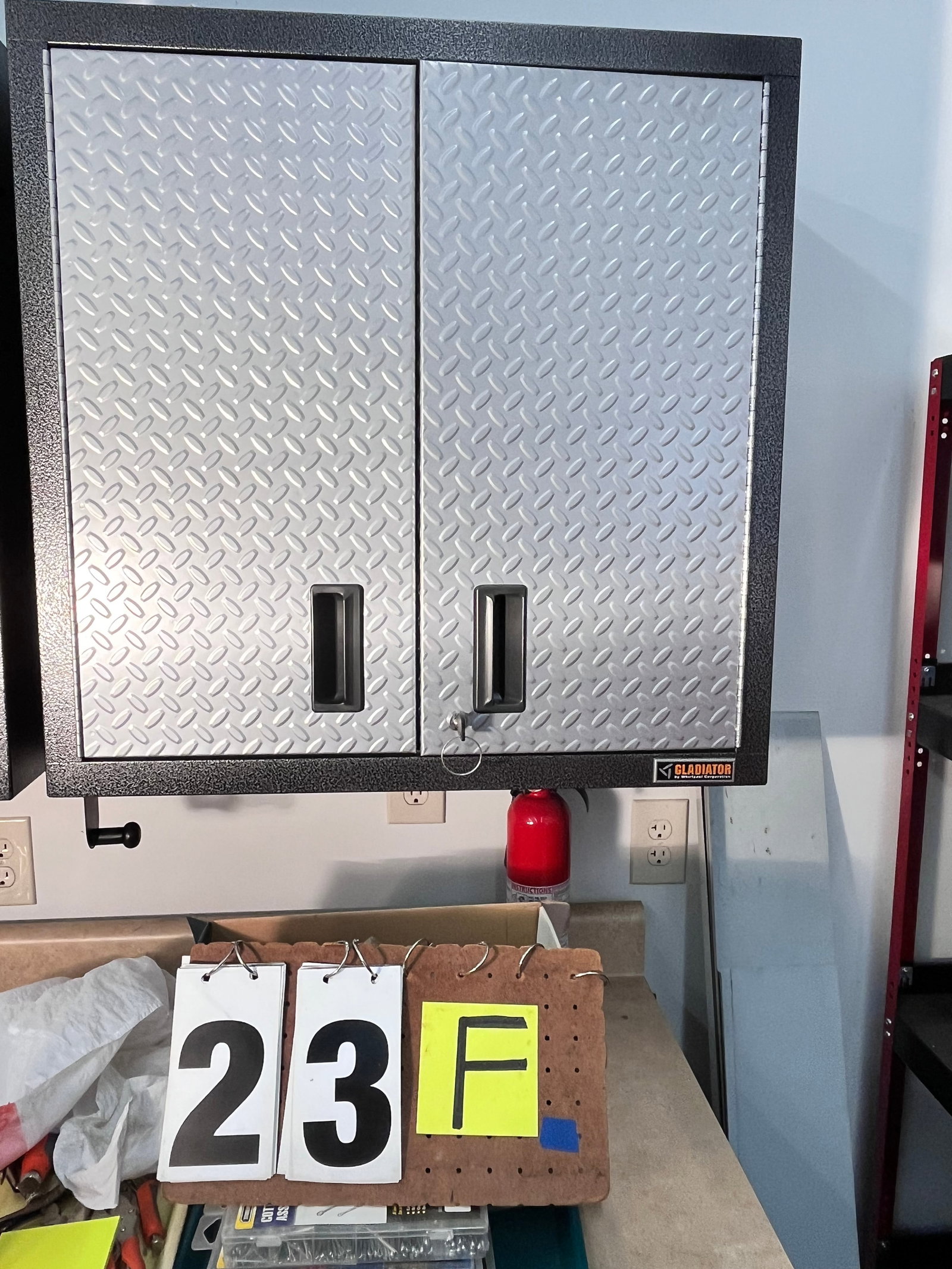 Four Matching Gladiator Metal Wall Cabinets: Four matching Gladiator by Whirlpool hanging metal wall cabinets with keys. In like new condition. 30"w x 12.25"d x 30"h. See photos. Please read the Terms and Conditions of this auction THOROUGHLY fo