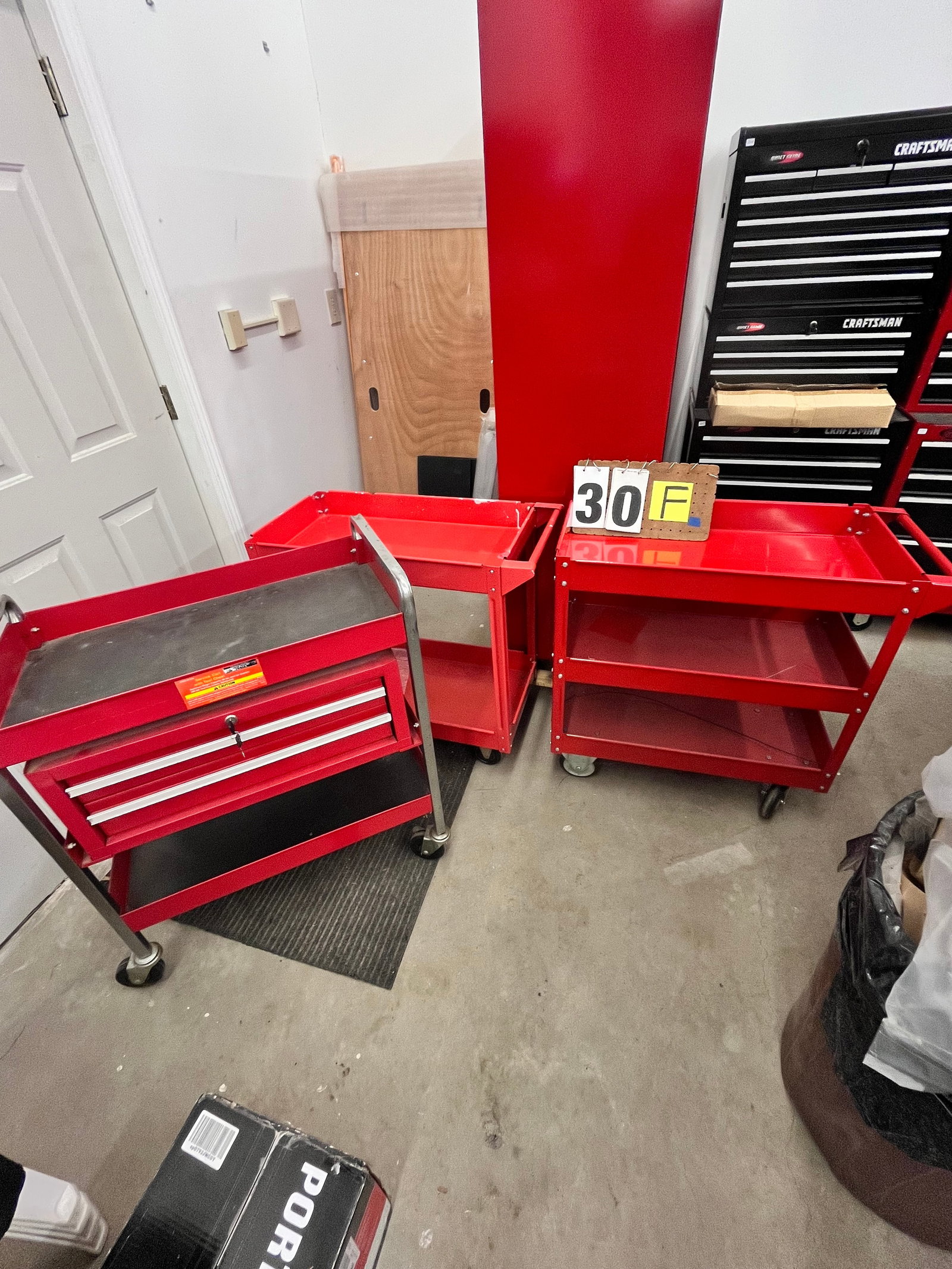 Three Harbor Freight Rolling Metal Carts: Three Harbor Freight rolling metal carts. In nice condition. 33"w x 16.25"d x 29.5"h, 33"w x 16"d x 31"h and 30"w x 16"d x 35.75"h. See photos. Please read the Terms and Conditions of this auction