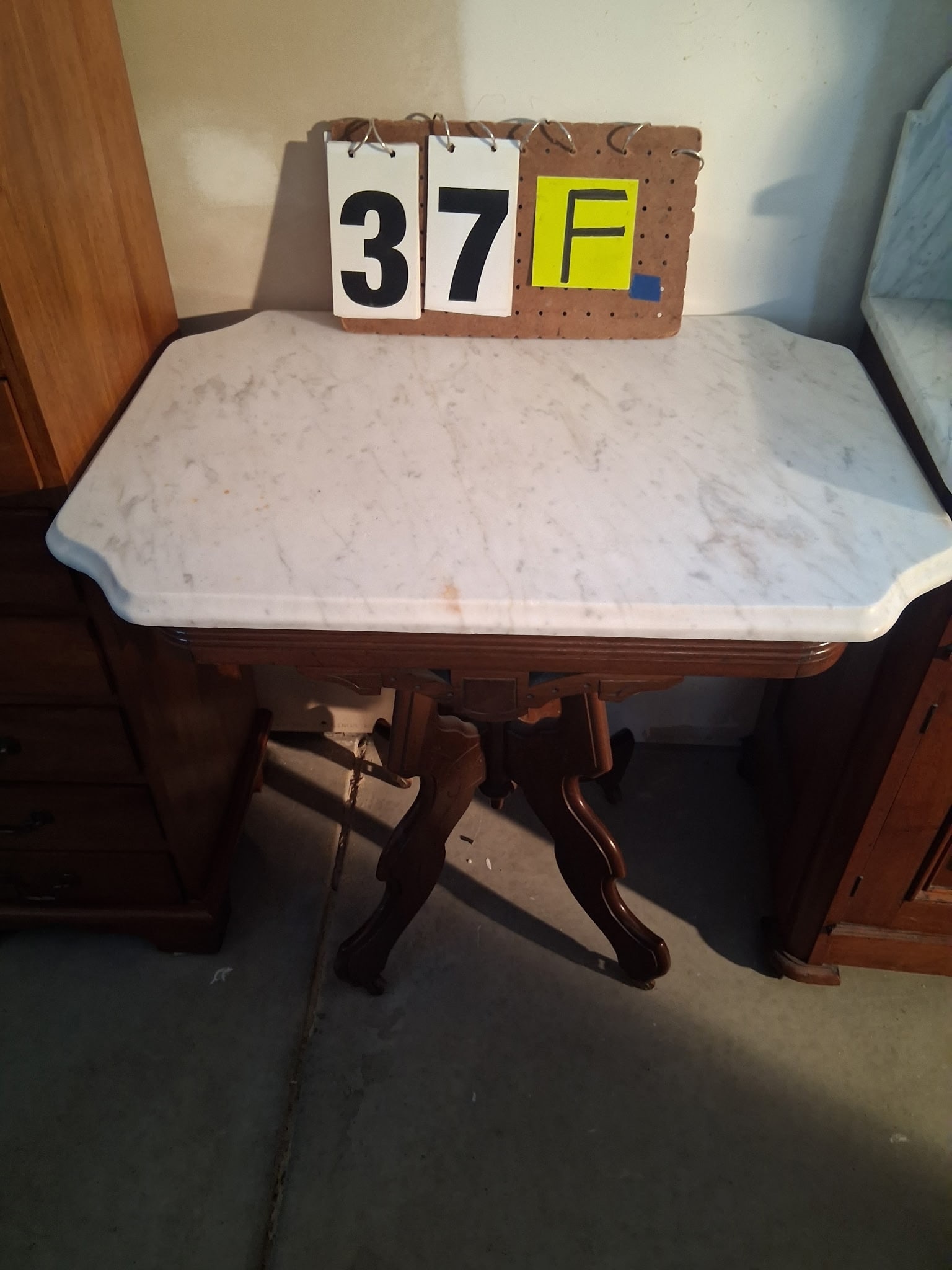 1890s American White Marble Top Walnut Table: 1890s American white marble top walnut table. 29.25"l x 21.125"w x 29.75"h. See photos. Please read the Terms and Conditions of this auction THOROUGHLY for IMPORTANT bidder information.