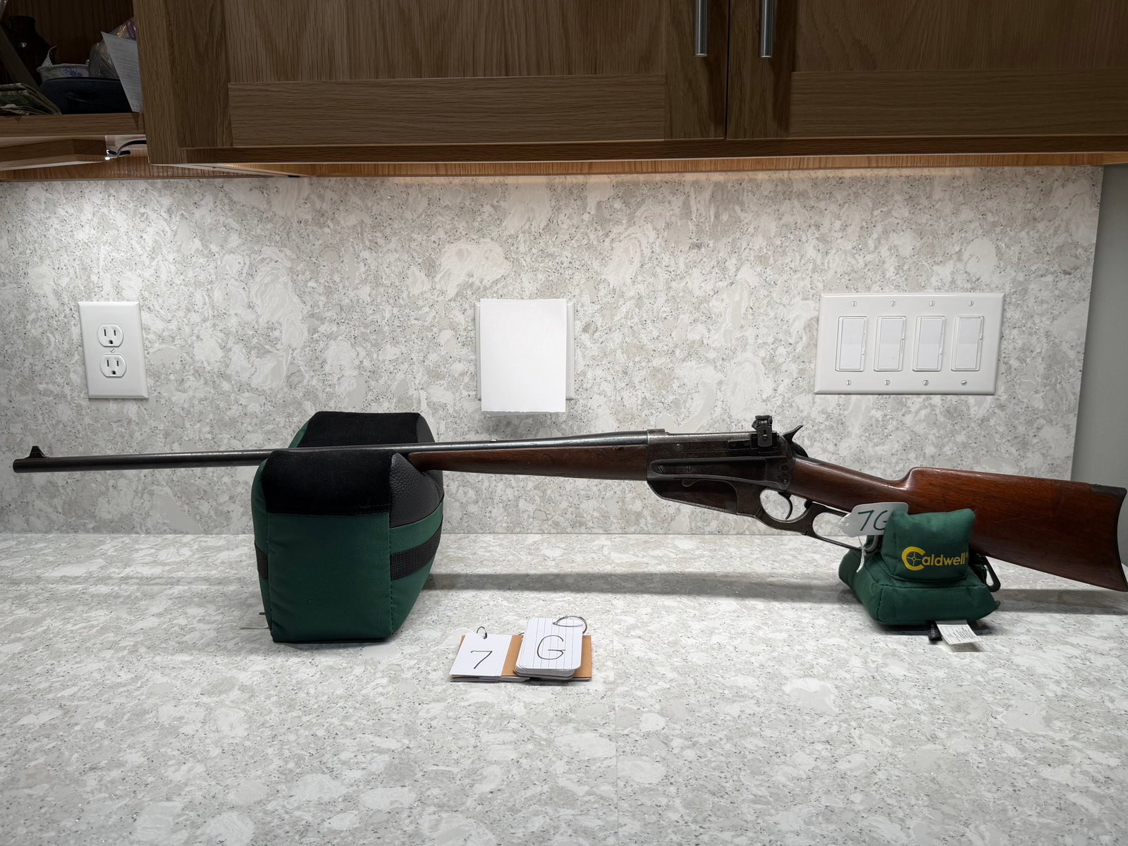 Winchester Model 1895: Winchester Model 1895. 30 ARMY (30-40 Krag). Second Model. 28" barrel. Lyman sights. Has a stamp on the barrel, "Barkley Cutlery Co., Canton, N.Y.". Stock has a large missing chip on the forearm and m