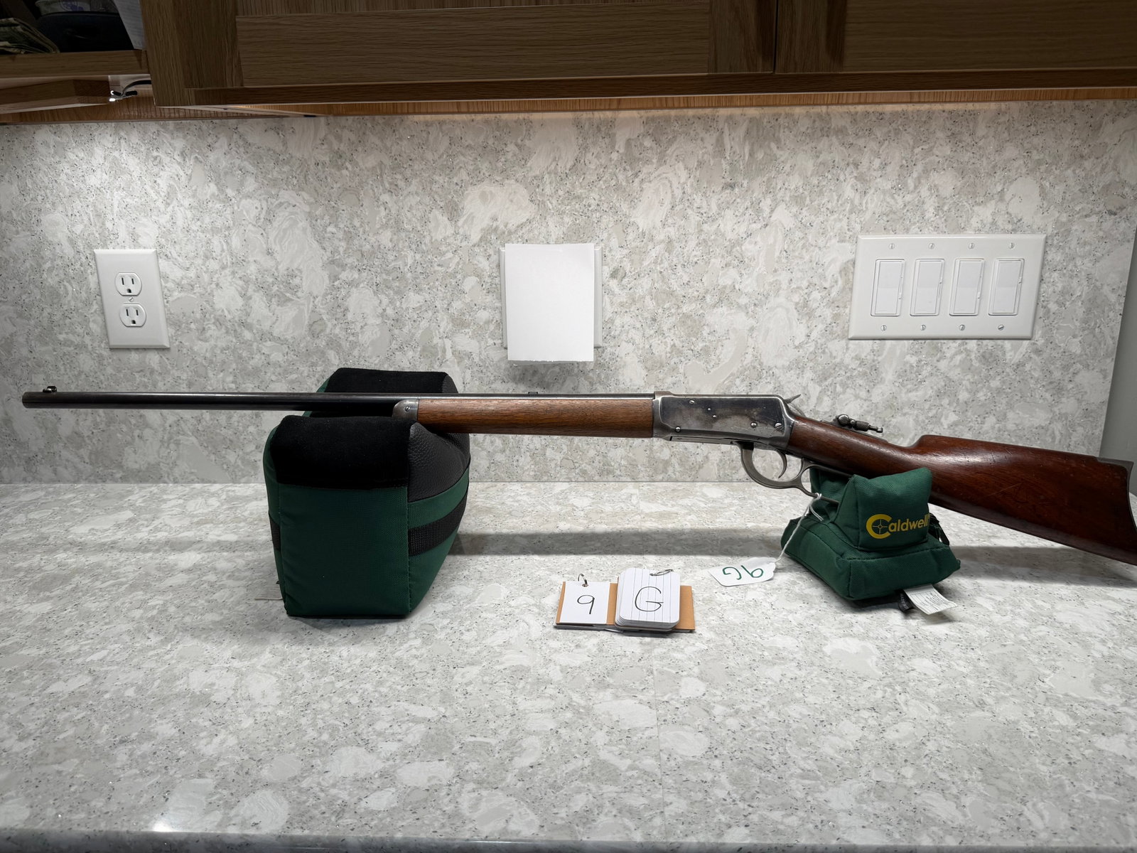 Winchester Model 1894: Winchester Model 1894. 32-40 caliber. 26" barrel. Button magazine. Walnut grip stock with smooth forearm and metal cap. Steel crescent shaped butt plate. Minor pitting and finish loss. Manufactured in