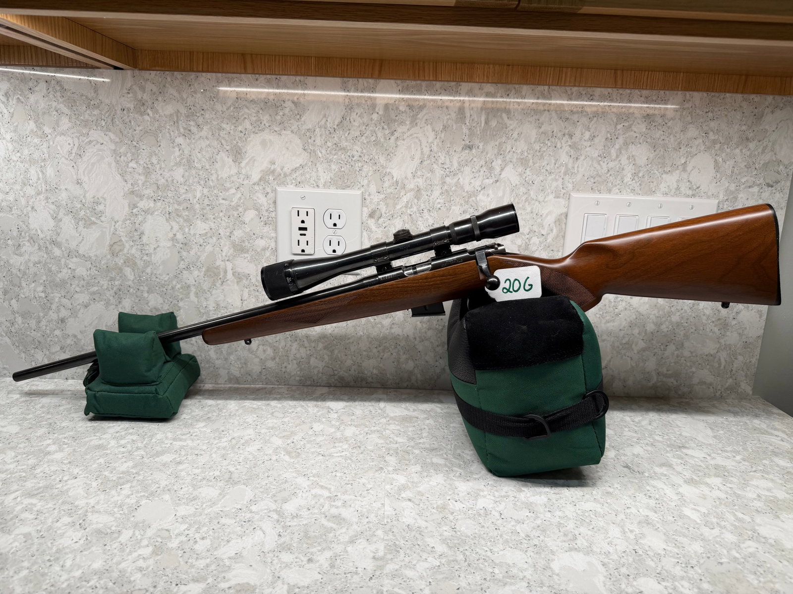 CZ Model 452-2E: CZ Model 452-2E ZKM American Caliber 17HMR. 22" barrel. Left handed. Walnut stock with two minor dings. Has Weaver V12 scope (50 ft - 1000 yards) with Weaver scope rings. Has sling studs with