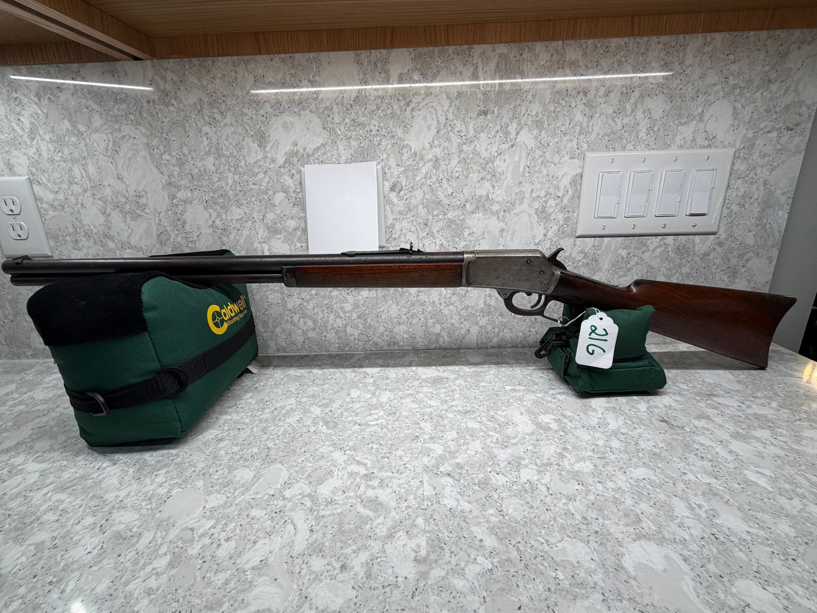 Marlin Model 1889 Flat Top: Marlin Model 1889 Flat Top. 44-40 WCF. 24" barrel. Very minor pitting. Has side ejection. Patent dates of October 11, 1887 and April 2, 1889. Has "Marlin Safety" on flat top receiver. Stock has four l