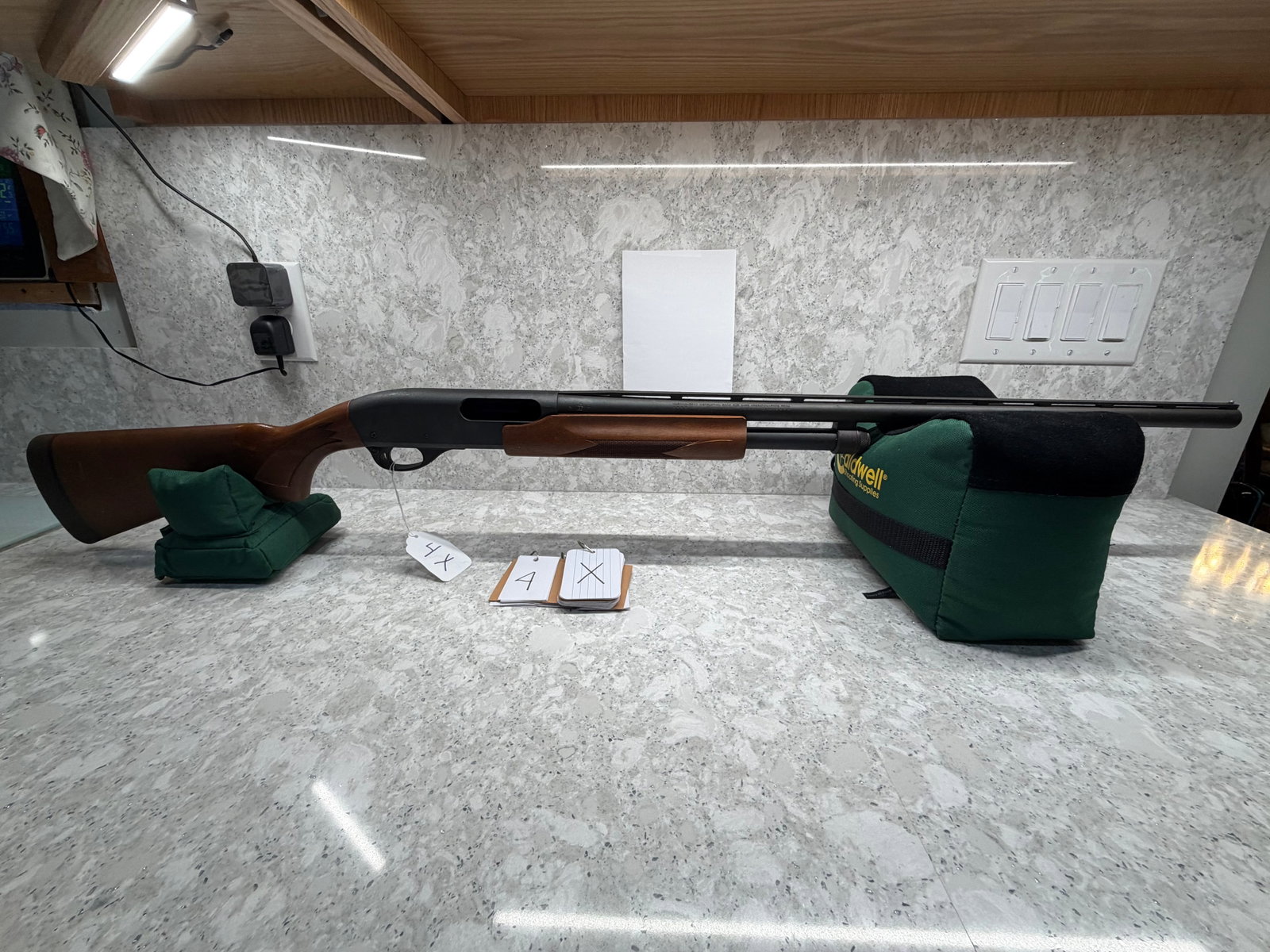 Remington 870 Express Magnum: Remington 870 Express Magnum 20 gauge shotgun, 2.75" or 3" shells. 25.5" ventilated rib barrel. Rem choke. Metal is in very good condition. Stock has some scratches and dings. Serial No. A115015U.