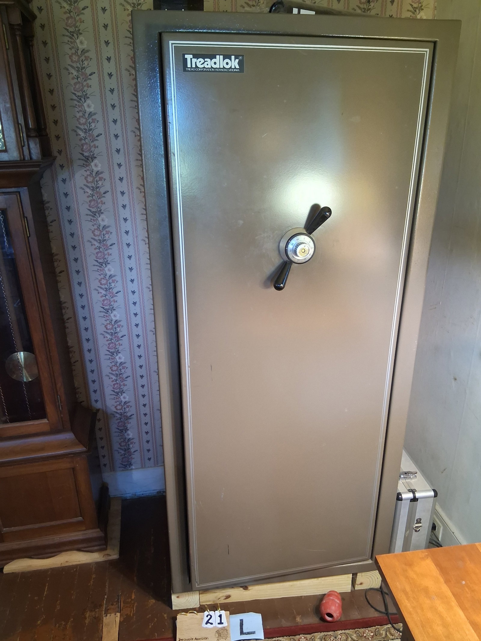 Treadlok Floor Safe with Combination Lock: Treadlok floor safe with combination lock. Tread Corporation, Roanoke, VA. Combination is known. VERY HEAVY. 28.5"w x 23"d x 64"h. See photos. Please read the Terms and Conditions of this auction THOR