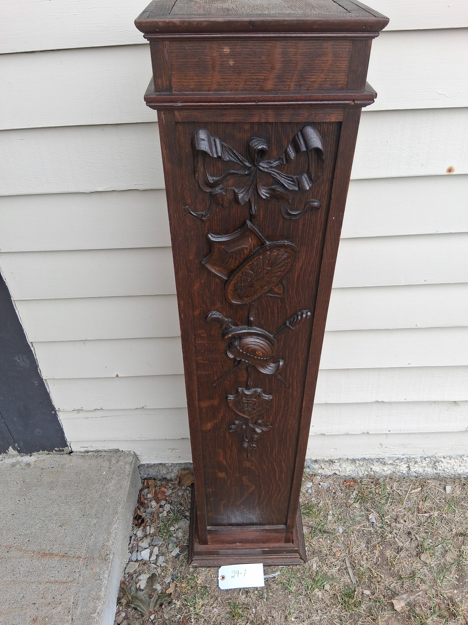 Nice 1890s American Oak Hand Carved Pedestal: Nice 1890s American oak hand carved pedestal with daggers, shield, helmet and more. 10.75"w x 9"d x 50.5"h. See photos. Please read the Terms and Conditions of this auction THOROUGHLY for IMPORTANT