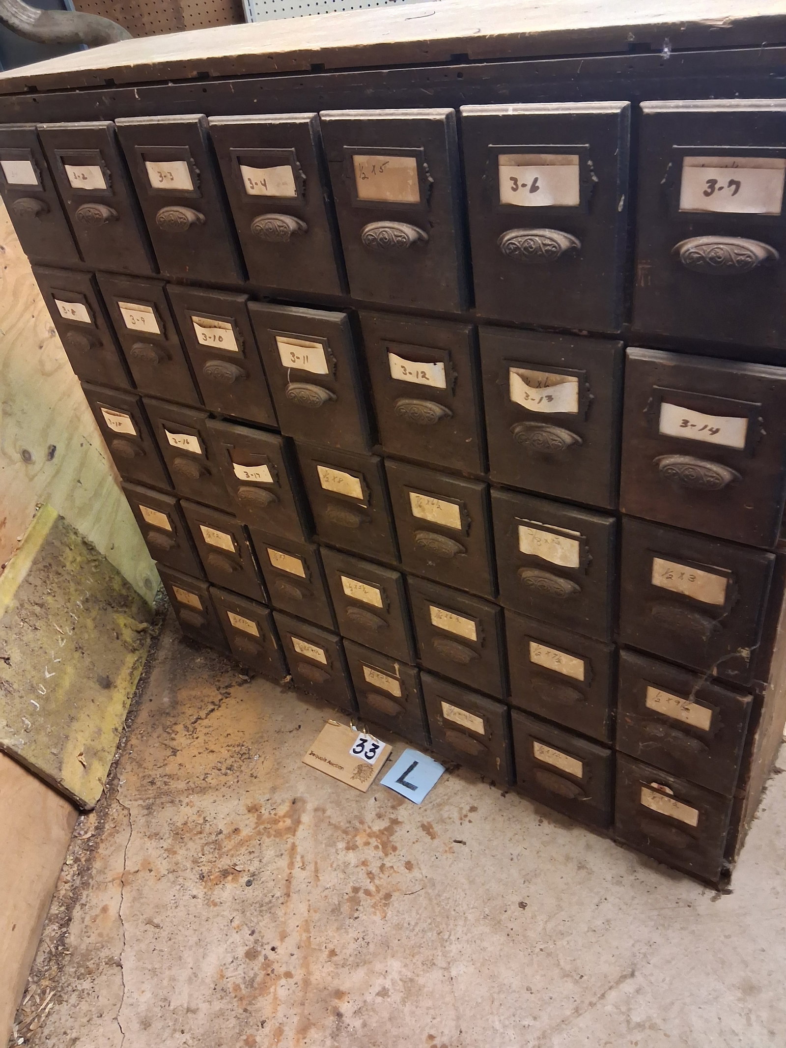 1900s 35 Drawer Dix Hardware Store Cabinet: 1900s 35 drawer Dix Hardware Store cabinet with nice iron handles. Drawers are 7.25"w x 14.5"d x 9"h. Cabinet is 54"w x 15"d x 50.5"h. See photos. Please read the Terms and Conditions of this auction 