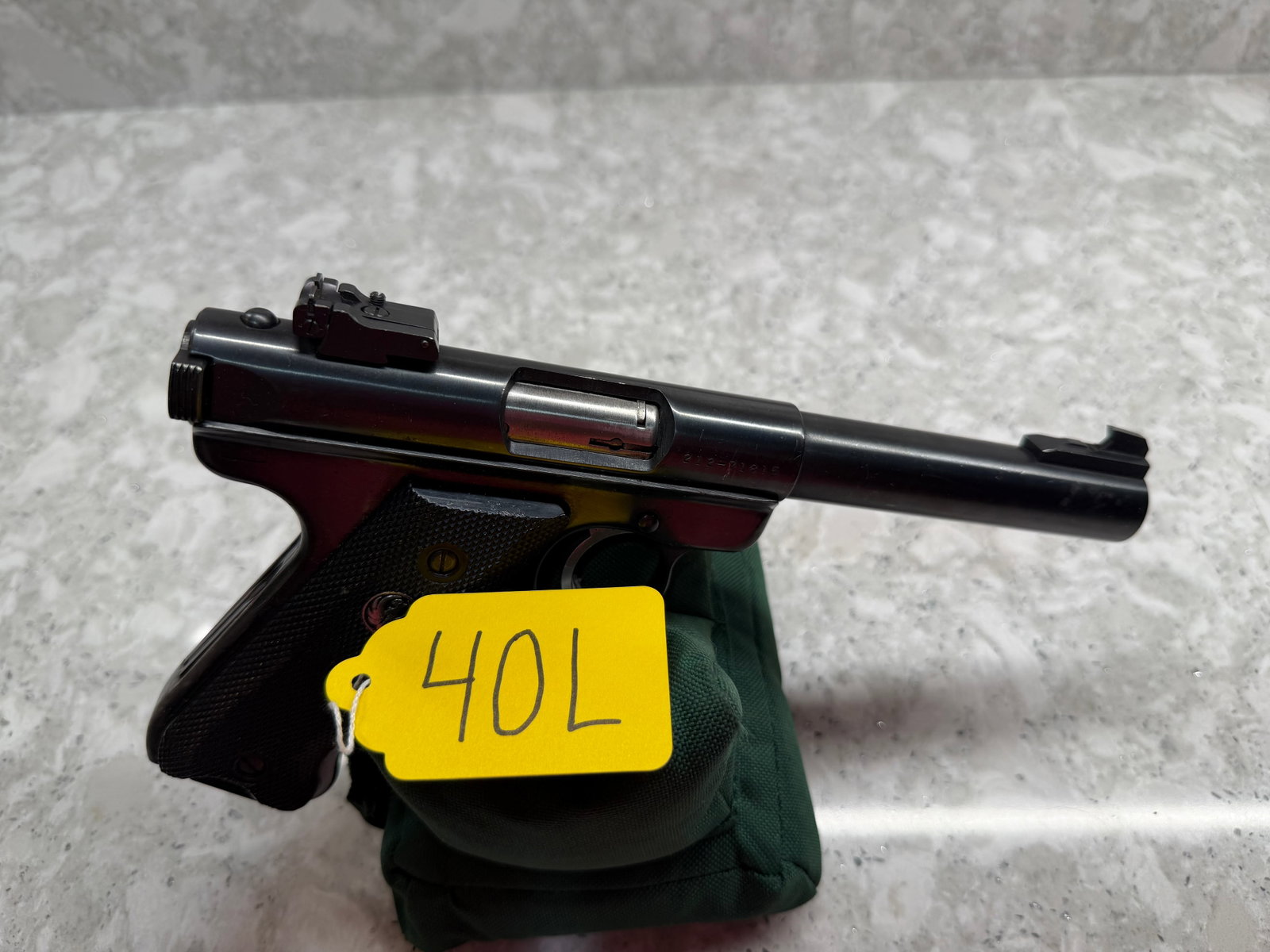 Ruger Mark II Target: Ruger Mark II Target. 22LR. 5.5" barrel. 10 round magazine. Has minor scratches in the metal. Manufactured in 1987. In overall good condition. Serial No. 212-71815. See photos. Please read the Terms