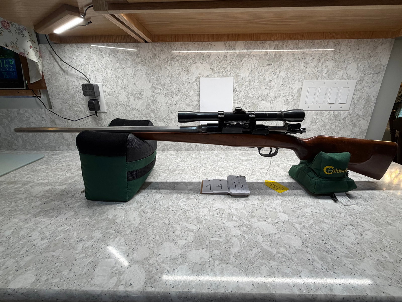 Amberg 1903 Sporterized Rifle: Amberg 1903 Sporterized Rifle. Unknown caliber. 23" round to octagon stainless barrel. No markings. Has a Weaver K6 scope. Stock has dings and scratches. Metal is on good condition. Serial No. 10351