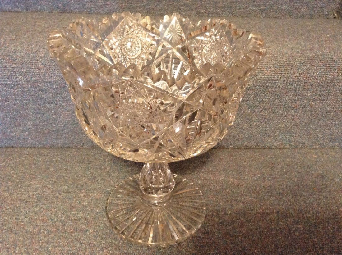 Controlled stem bubble large brilliant period cut glass: From the home of Dr. Jerry Jacobson M.D. Surgeon. Controlled stem bubble large brilliant period cut glass compote on vase. Minor normak flaking at top otherwise mint condition. 8 1/2"W x 19 1/2"H.