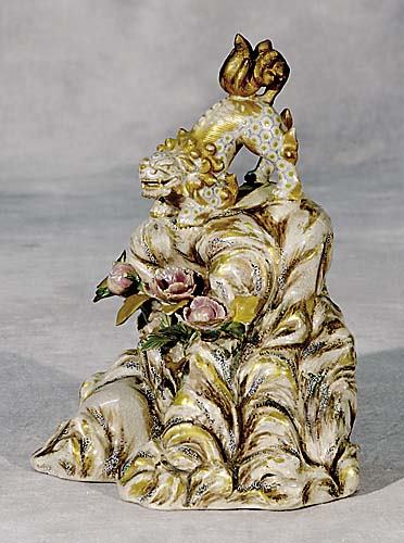 Japanese Satsuma mythical creature Meiji period: fearsome shishi atop rock formation with blooming flowers. H12 1/2" *Reference: Lawrence, Louis. SATSUMA: MASTERPIECES FROM THE WORLD'S IMPORTANT COLLECTIONS. London: Dauphin, 1991. p.201.