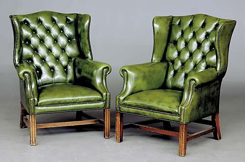 Pair Georgian style green leather wingback chairs