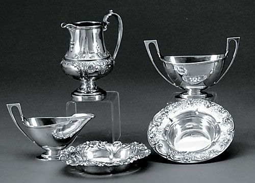 Assortment of five sterling table accessories: Assortment of five sterling table accessories petite repousse pitcher by Ellmore, H5 1/2" L4 1/2" W3 1/2"Gorham cream and sugar set, engraved with ititial K and 1864, H3 1/3" L5 1/2" W2 3/8"small repo