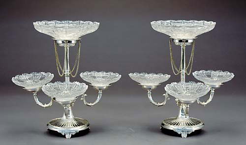 Pair Sheffield silverplate epergnes: Pair Sheffield silverplate epergnes center stem supporting large bowl and three scrolling arms with corresponding bowls, resting on round footed base.H16 1/4" Dia.16 1/2"