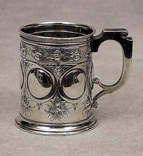 Gorham coin silver mug circa 1860: Gorham coin silver mug circa 1860 chased floral design; underside marked: 194, coin. (Top rim bent)@Size:H3 3/8", 168 grams