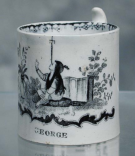 Staffordshire child's mug Date: circa 1: Staffordshire child's mug Date: circa 1840 decorated with scene of young boy balancing a sword on his nose and name GEORGE in black en grisaille and fitted with London handle. (Some minor wear to surf