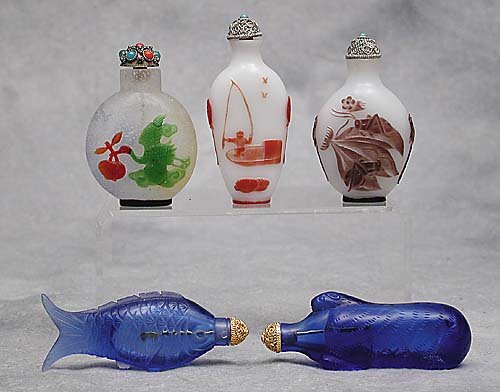 Five glass snuff bottles one blue glass: Five glass snuff bottles one blue glass fish form; one blue glass rodent form; one multi-color on white cameo glass with bird and fish design; one with purple on white depicting grasshoppers; and the