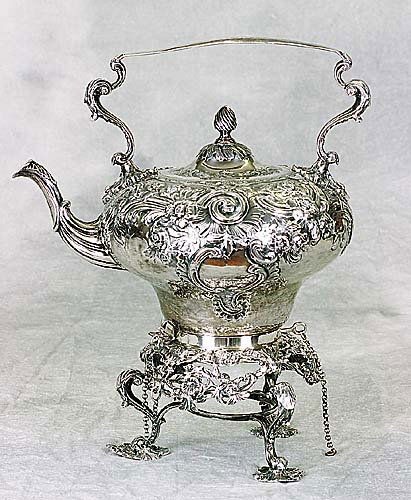 Victorian sterling kettle on stand, by C: Victorian sterling kettle on stand, by Charles Stuart Harris London 1898 melon-form body with elaborately chased floral designs, resting on scrolling stand with S-scroll legs and leaf-form feet. (Very