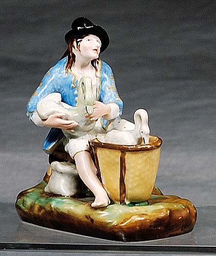 Paris porcelain Jacob Petit figural grou: Paris porcelain Jacob Petit figural grouping circa 1860 depicting figure of a man sitting on a basket tending two swans, marked JP with dots in blue underglaze. (Good condition with slight wear to bac