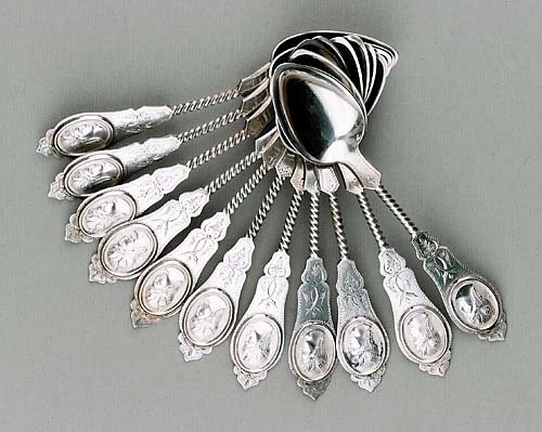 Eleven American coin silver 'Medallion' ice cream: Eleven American coin silver 'Medallion' ice cream spoons, by Duhme & Co circa 1865, Cincinnati, OH shaped end with profile of medallion and twist handle; engraved 'Beall' and marked by maker. (Good or