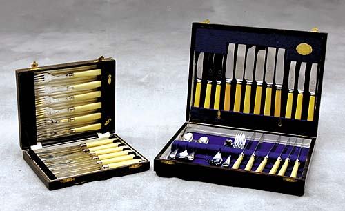 English silverplate fish set and flatware: circa 1925 Description: six forks and six knives, L8", in fitted leather case; with flatware set in fitted wooden case, comprising: twelve knives, L8 1/4"; six fruit knives, L6"; six forks, L7", six t