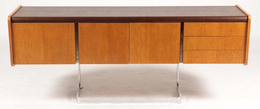 LABELED STE. MARIE & LAURENT MONTREAL CREDENZA: A labeled 'Ste. Marie and Laurent Montreal Canada' credenza having three drawers and three doors supported on chrome base. Ht: 29" Wd: 72" Dpth: 19"