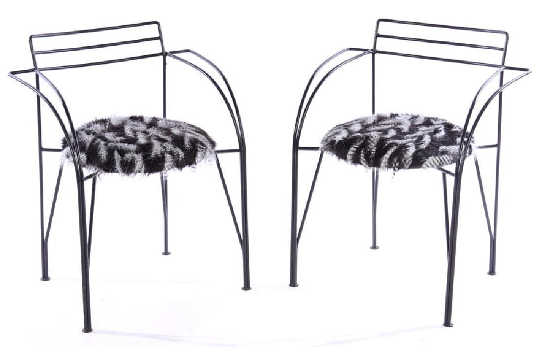 PAIR OF PASCAL MOURGUE WROUGHT IRON CHAIRS: A pair of Pascal Mourgue wrought iron chairs with feather form upholstered seats. Ht: 29" Width: 24" Depth: 20"