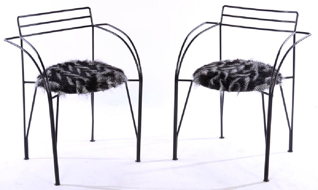 PAIR OF PASCAL MOURGUE WROUGHT IRON CHAIRS: A pair of Pascal Mourgue wrought iron chairs with feather form upholstered seats. Ht: 29" Width: 24" Depth: 20"