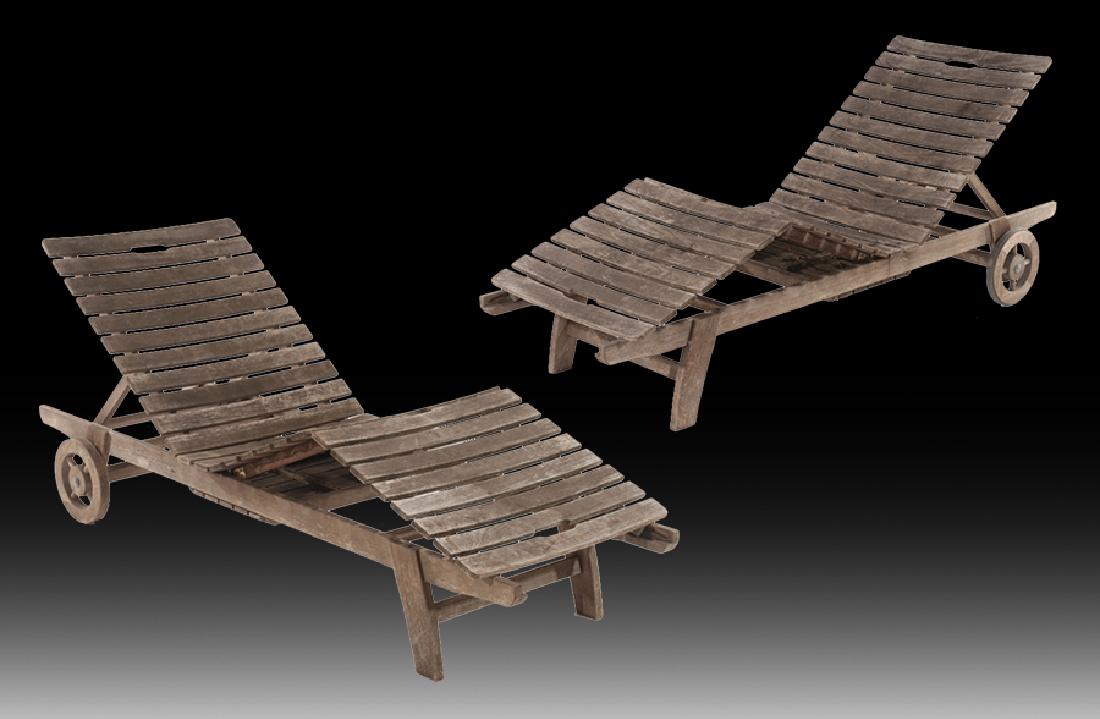 PR SMITH HAWKEN TEAK RECLINERS SLAT SEATS: A pair of 'Smith and Hawken' teak recliners with slat seat and wheels. Wd: 78.5" Dpth: 26.5" Seat: 13" (flat)