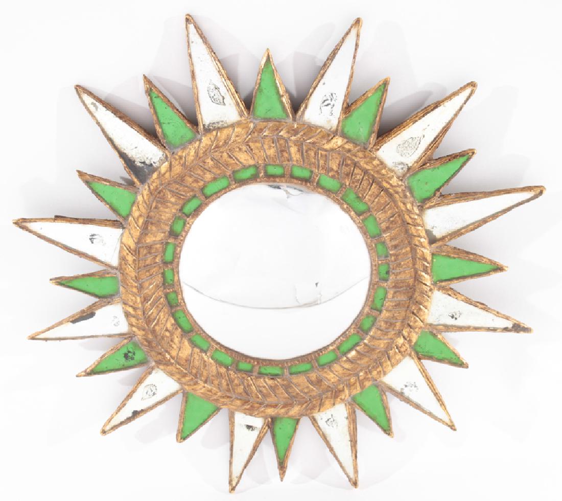 STAR FORM GREEN GLASS MIRROR LINE VAUTRIN STYLE: A star form green glass mirror in the manner of Line Vautrin. Ht: 24"