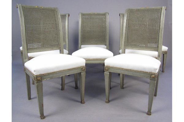 EIGHT HIGH BACK PAINTED GILT DINING ROOM CHAIRS CHAIR: SET OF EIGHT HIGH BACK POLYCHROME & GILT DINING ROOM CHAIRS CIRCA 1900. Mounted with bronze claw feet and a double cane back, finished in newer white fabric H: 38.5" W: 19" D: 21.5" *Condition: Good -