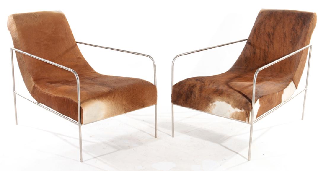 PAIR NICKEL OVER IRON ELONGATED CHAIRS IN COWHIDE (1 of 6)