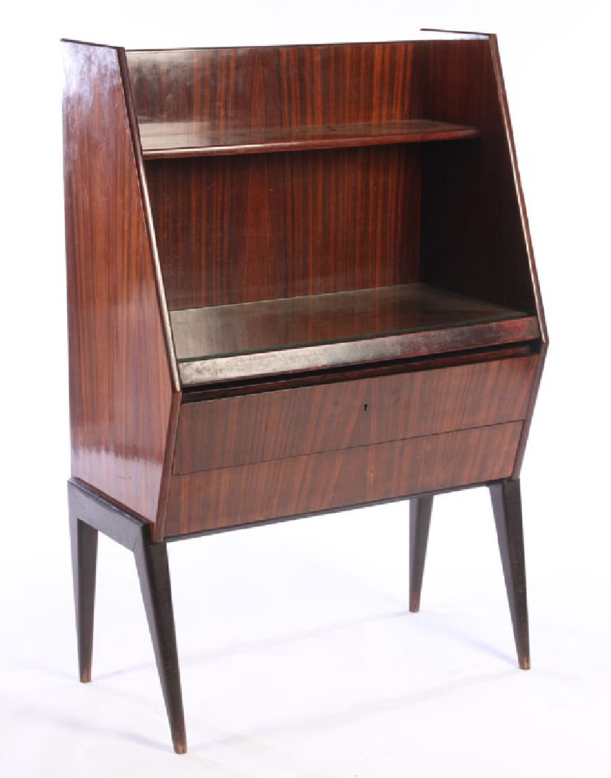 ITALIAN ROSEWOOD DESK SLIDE OUT DESK 1960: An Italian mid century modern rosewood desk having an open shelf over slide out desk and two blind drawers circa 1960. All supported on tapered legs. Ht: 51.5" Width: 33.5" Depth: 18.5"