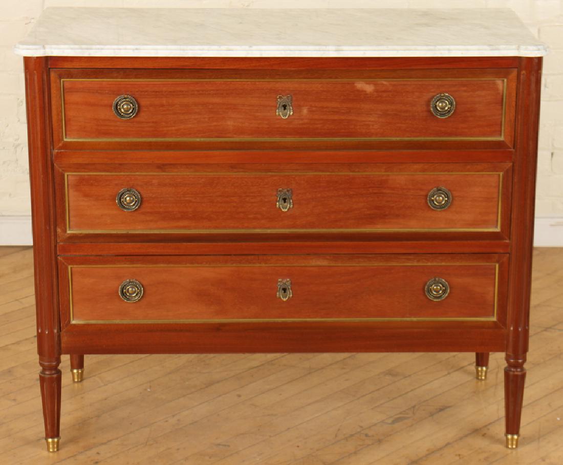LOUIS XVI STYLE MAHOGANY MARBLE TOP COMMODE: A French Louis XVI style mahogany marble top commode comprised of three drawers raised on fluted and tapered legs circa 1950. Ht: 35.5" Wd: 40" Dpth: 17"