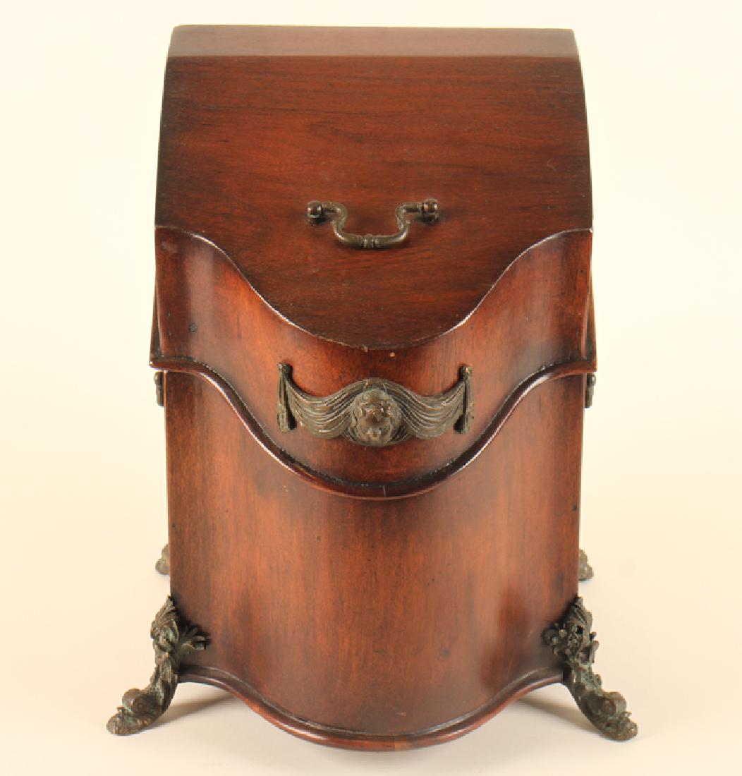 SMALL MAHOGANY BOX ON BRONZE DOLPHIN FEET: A small mahogany box having figural accents raised on stylized bronze dolphin feet. Ht: 15" Wd: 11" Dpth: 10"