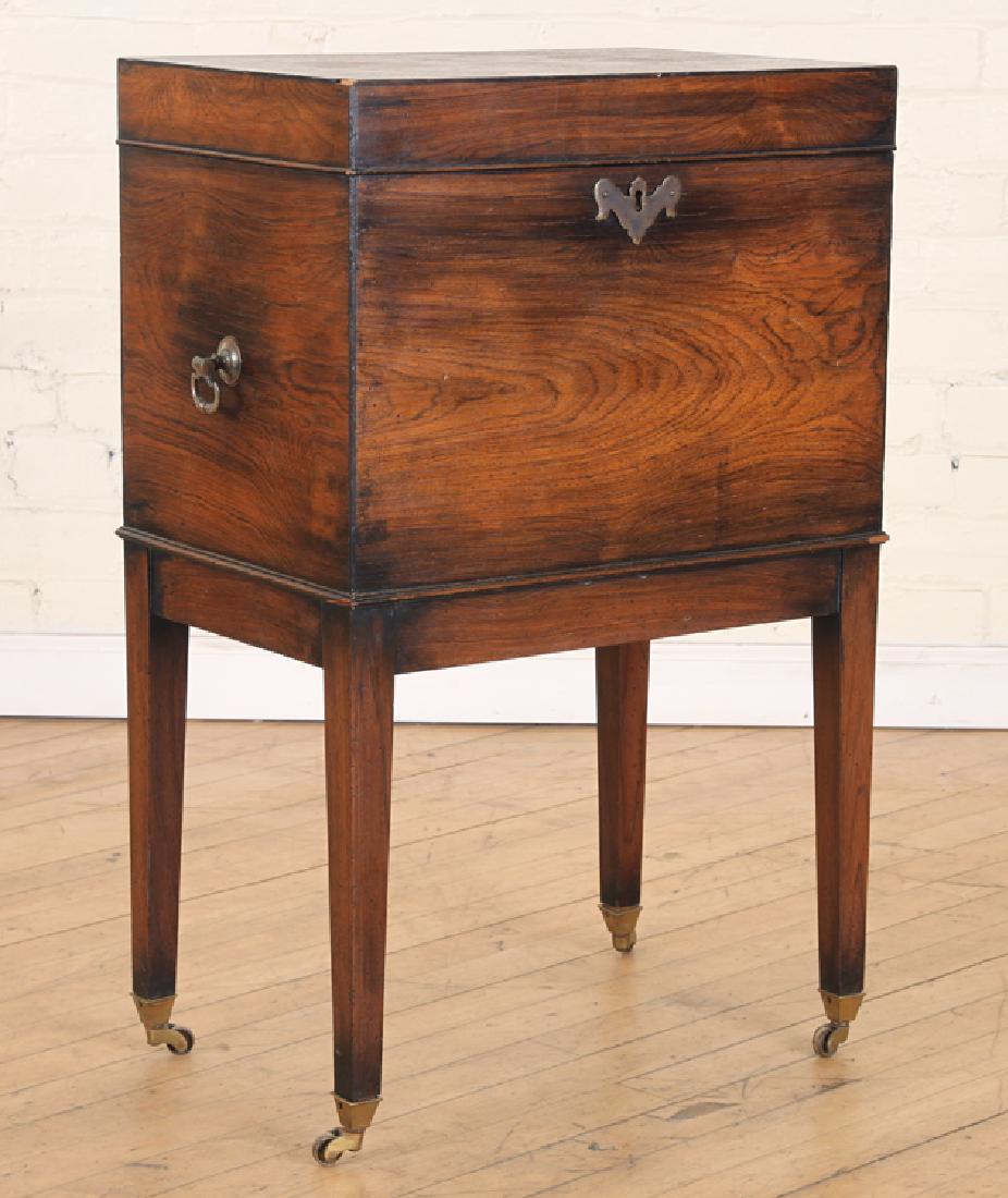 ENGLISH ROSEWOOD BRASS LIFT LID CELLARETTE C.1900: An English rosewood brass decorated lift lid cellarette raised on gently tapered legs circa 1900. Ht: 28.75" Wd: 18.5" Dpth: 12"