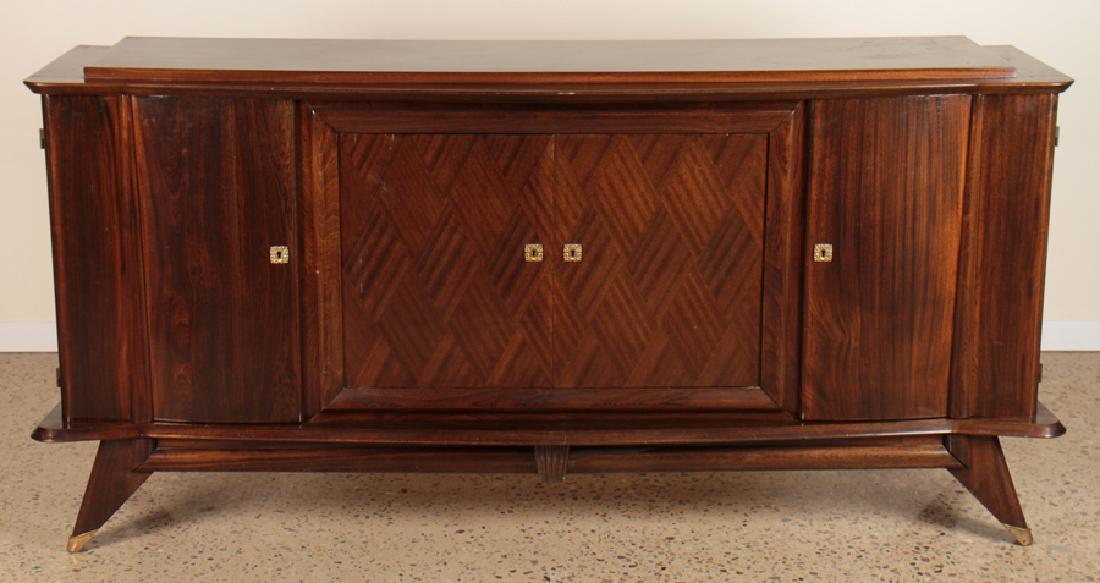 FRENCH ROSEWOOD SIDEBAORD CIRCA 1940: A French rosewood sideboard having four doors and shaped front resting on shaped base with tapered legs circa 1940. Ht: 40" Wd: 81.5" Dpth: 20"