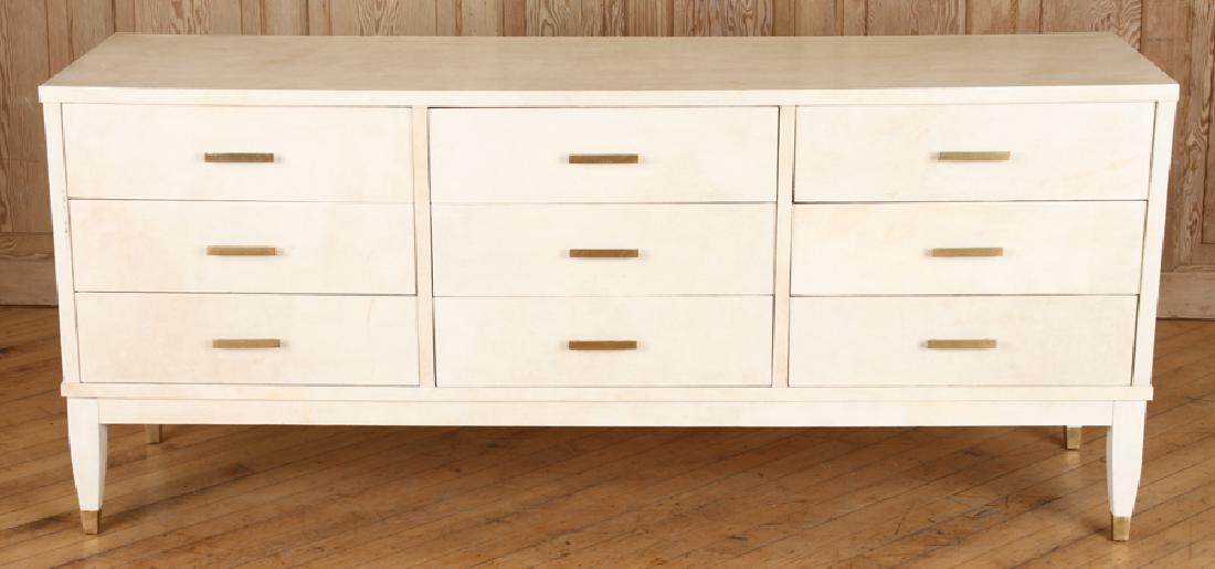 9 DRAWER COMMODE MANNER OF JEAN-MICHEL FRANK 1960: A nine drawer parchment covered commode in the manner of Jean-Michel Frank circa 1960. Ht: 27" Wd: 63" Dpth: 16.5"