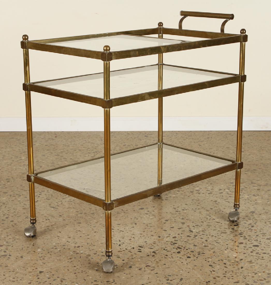 A BRONZE AND GLASS BAR CART CIRCA 1970: A bronze and glass bar cart circa 1970. Ht: 28.5" Wd: 29" Dpth: 18"