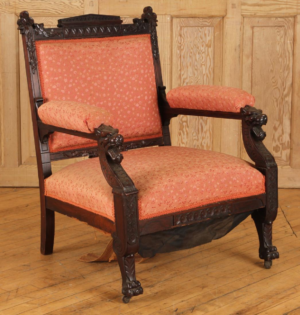 LATE 19TH C. RENAISSANCE REVIVAL ARM CHAIR: A late nineteenth century American Renaissance Revival arm chair having carved frame, upholstered arms and raised on paw feet. Ht: 35.5" Wd: 29.5" Dpth: 28.5"