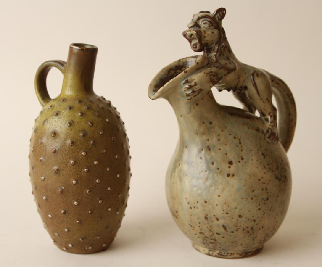 COLLECTION 2 ROYAL COPENHAGEN STONEWARE VESSELS: A collection of two Royal Copenhagen stoneware vessels, including one Bode Willumsen circa 1950. Bode Willumsen (Danish, 1895-1989) A stoneware jug having lion handle: 9.25" The ovoid form vase with t