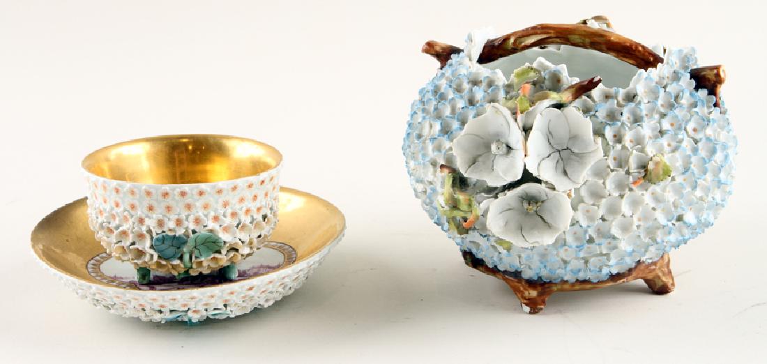 TWO CONTINENTAL SNOWBALL PORCELAIN TABLE ITEMS: A lot of two nineteenth century Continental Snowball (Schneeballen) porcelain table articles in the Meissen style. Consisting of: One handled vase, unmarked: 4.25" A tea cup and saucer, unmarked