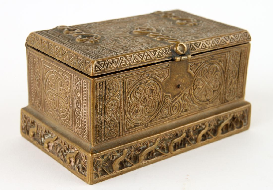 TIFFANY BRONZE DOUBLE INKWELL VENETIAN PATTERN: A Tiffany bronze double inkwell in the Venetian pattern. Marked Tiffany Studios, New York, #1641. Lacking one glass liner. Ht: 2.5" Wd: 5.25" Dpth: 3.25"