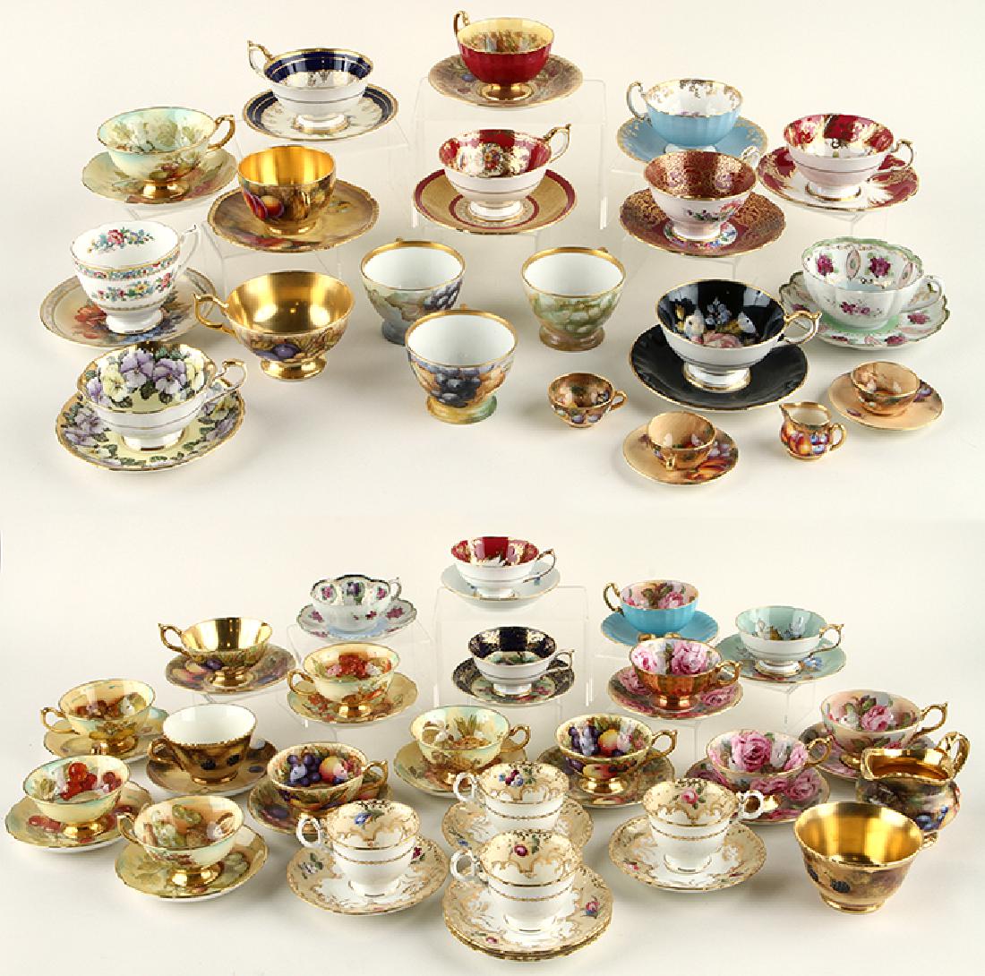 35 HAND PAINTED PORCELAIN TEA CUPS AND SAUCERS: A collection of thirty five hand painted porcelain tea cups and saucers along with six cups and a creamer. To include: Paragon, Aynsley, Royal Stafford, Royal Worcester and Continental