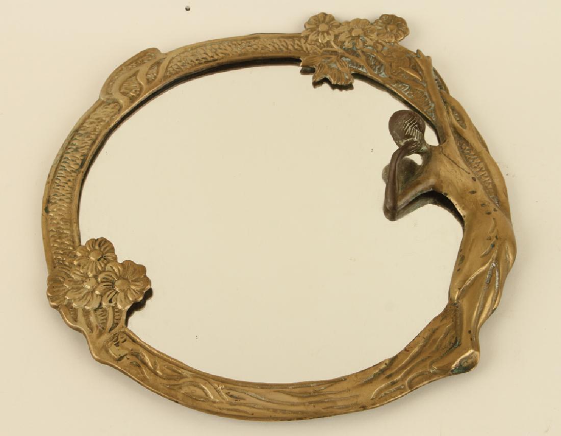 AN ART NOUVEAU FIGURAL BRASS MIRROR C.1920: An Art Nouveau figural brass dressing table mirror circa 1920. Ht: 15" Wd: 15.5"