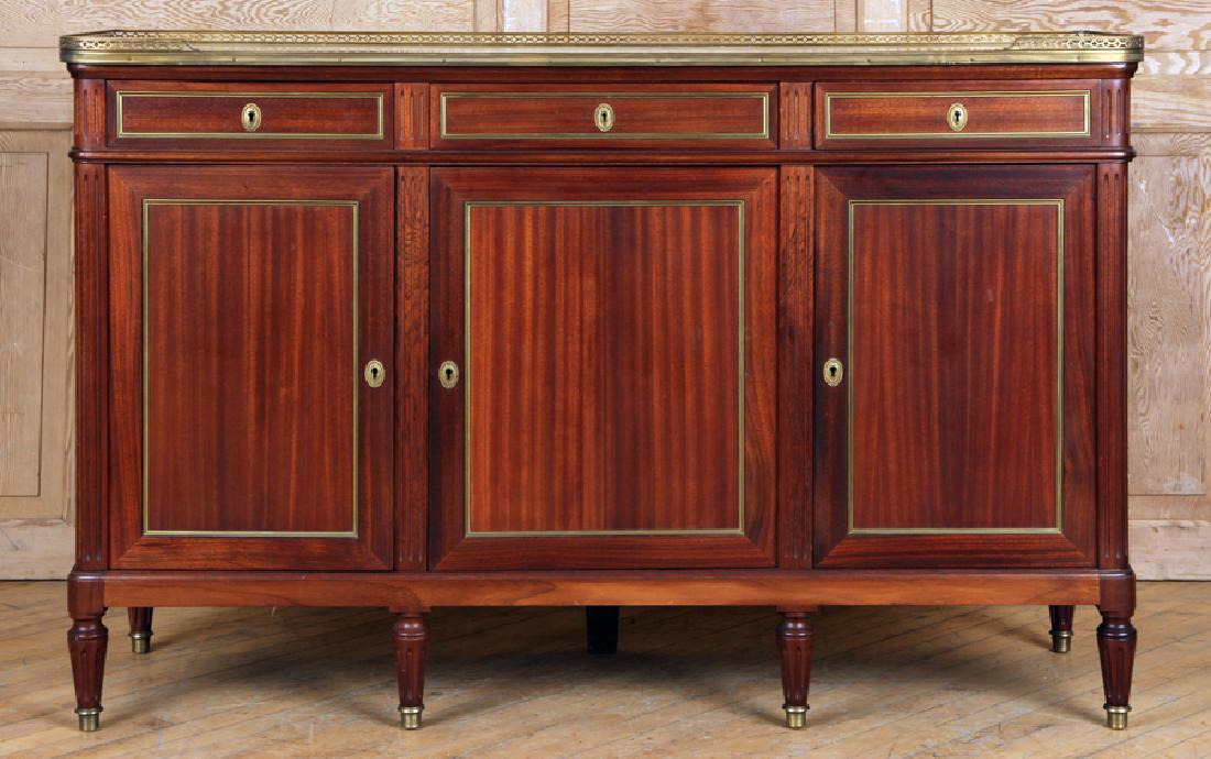 FRENCH MAHOGANY LOUIS XVI STYLE SIDEBOARD C.1940: A French mahogany Louis XVI style sideboard circa 1940. The case having three drawers over three doors supporting a marble top with a bronze gallery. Ht: 40" Wd: 62.5" Dpth: 19.5"